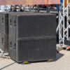 (iStock) - Powerful outdoor concert sound system with large speakers on stage front for live music performance.